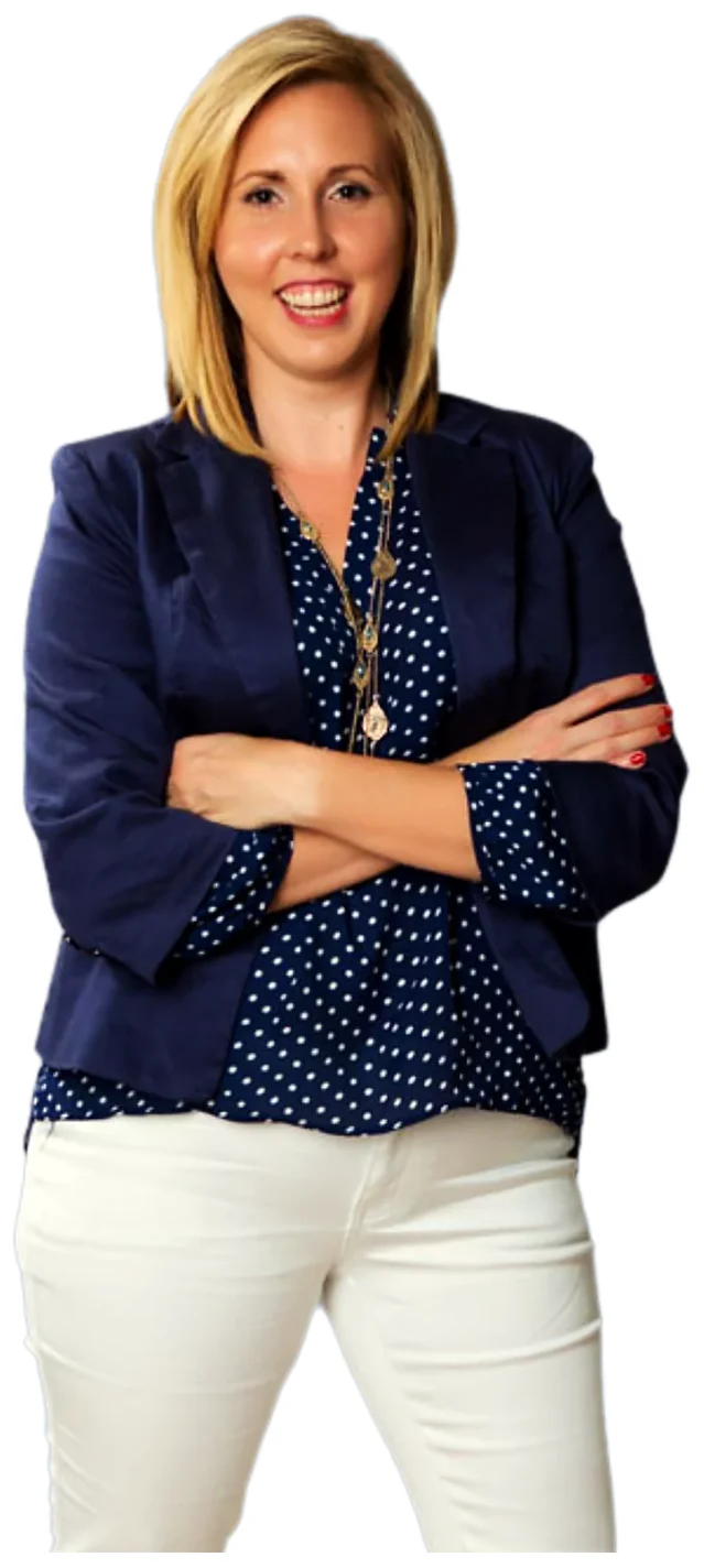 Sarah Stahl, arms crossed, smiling confidently