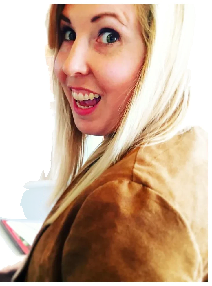 Sarah Stahl glancing over her shoulder with a big grin